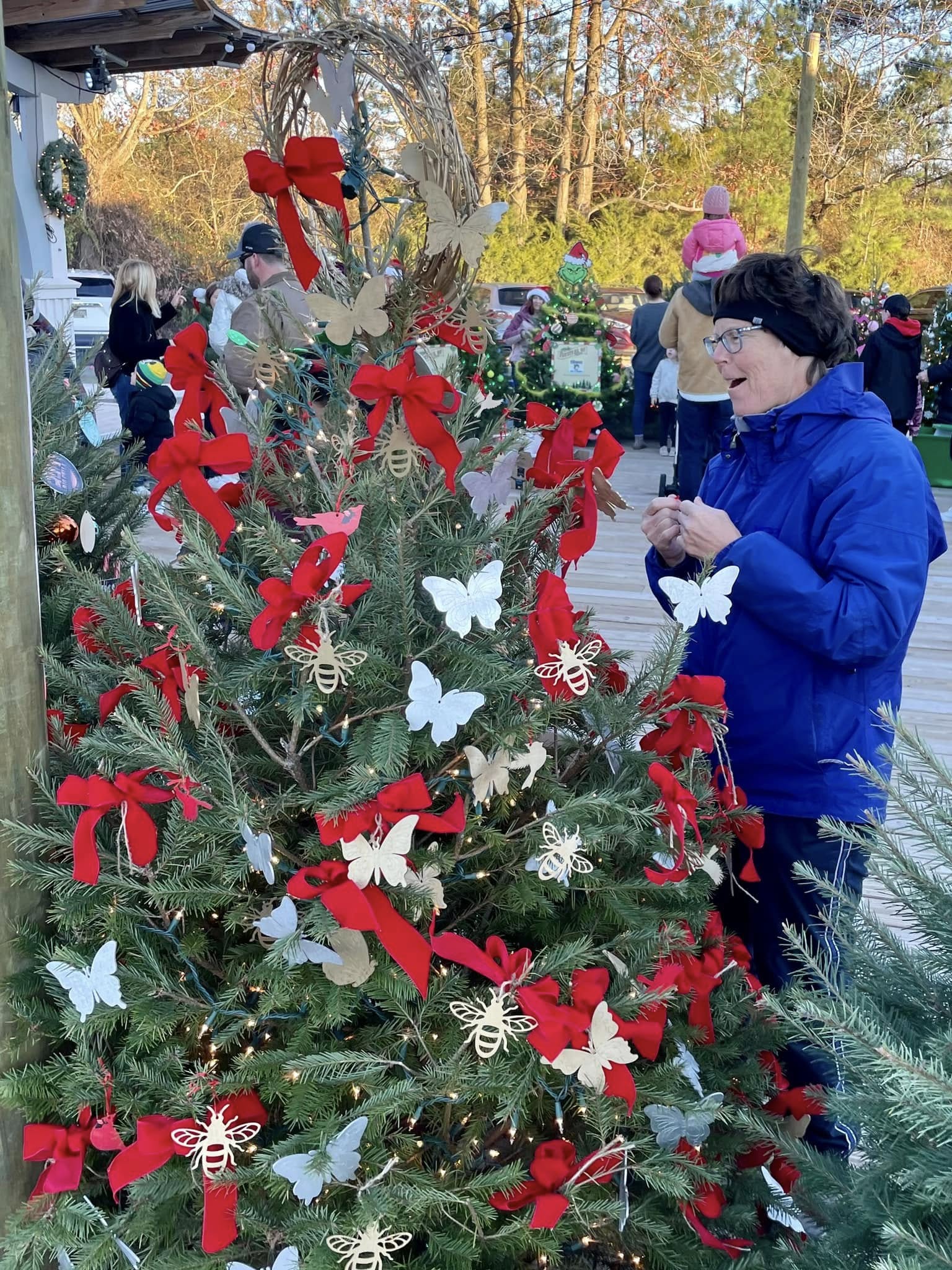 Holiday market with decorated trees and festive bows